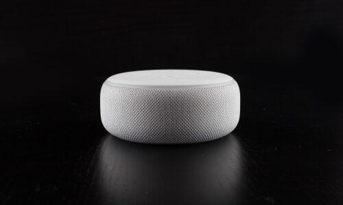 An Echo Dot with the Amazon Alexa voice assistant on it.